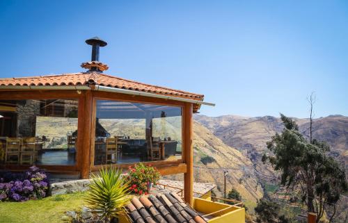 a gazebo with a view of a mountain at Refugio Viñak in Viñak