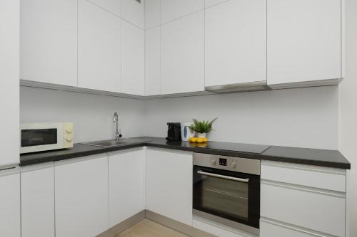Foto Stylish Apartment in Browary Warszawskie with Air Conditioning & Parking by Noclegi Renters 3