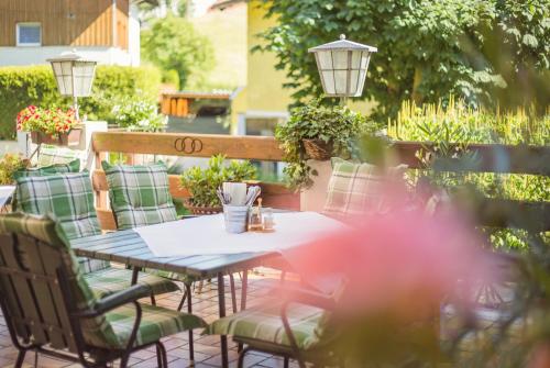 a table and chairs on a patio at Hotel Gasthof Zum Kirchenwirt in Puch bei Hallein