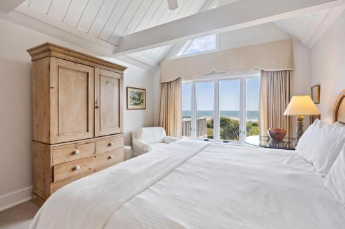a white bedroom with a large bed and a window at SS3559: 3559 Seascape in Kiawah Island