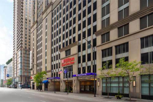 an empty street in front of a tall building at Hilton Garden Inn Chicago Downtown/Magnificent Mile in Chicago