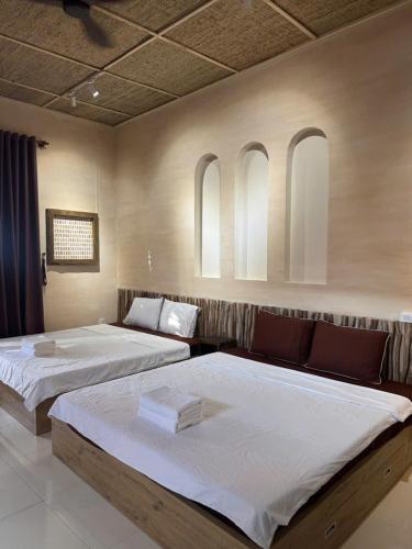 Ένα ή περισσότερα κρεβάτια σε δωμάτιο στο The Latte Home Phan Thiet