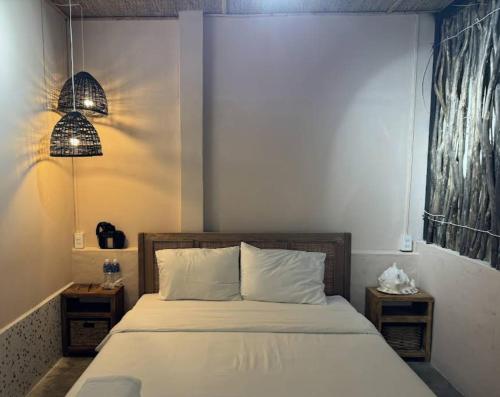 Ein Bett oder Betten in einem Zimmer der Unterkunft The Chan Chan Home Seaside Phan Thiet
