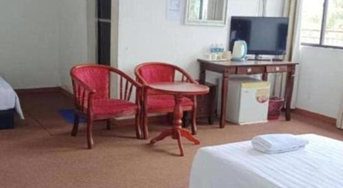 TV a/nebo společenská místnost v ubytování OYO 90785 Pandan Hotel