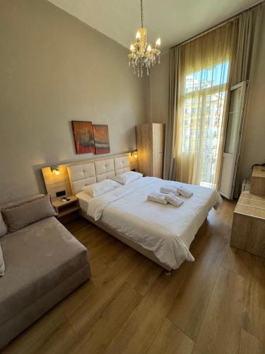 Ένα ή περισσότερα κρεβάτια σε δωμάτιο στο Hotel Ilisia 