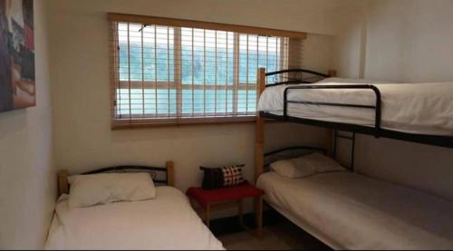 Ένα ή περισσότερα κρεβάτια σε δωμάτιο στο Step into the OCEAN