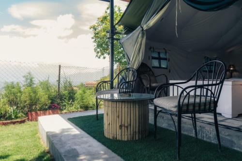 a table and chairs under a tent at Know About Destinations in Kathmandu