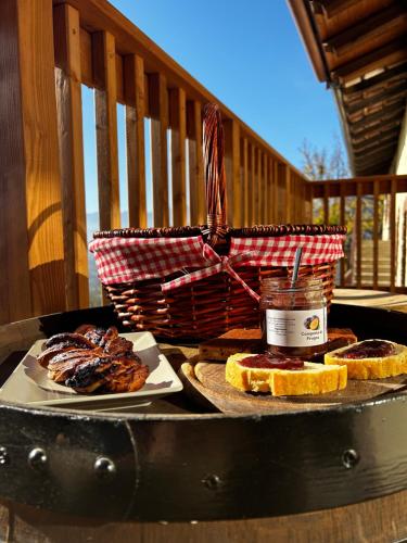 a table with bread and a basket and a plate of food at Agriturismo Dai Dellerba in Pinerolo