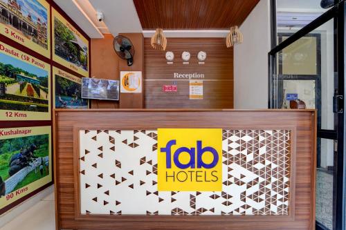 a toro hotels sign on a counter in a store at FabHotel NRM Residency in Mysore