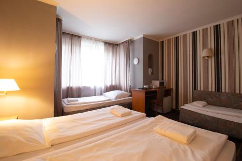 Postel nebo postele na pokoji v ubytování Villa Diana WestEnd