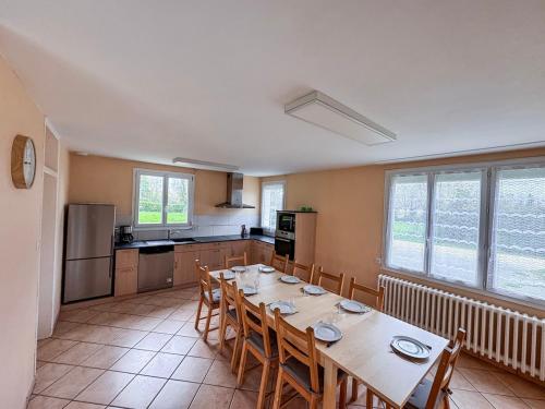 a kitchen with a table and chairs in a room at Grande maison 5 chambres 25 min du Parc in Chavagnes-les-Redoux