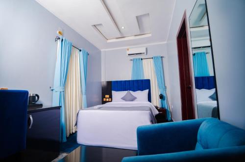 Ένα ή περισσότερα κρεβάτια σε δωμάτιο στο Asato Hotel