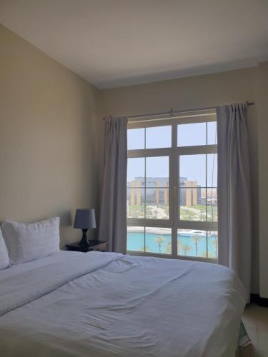 Postel nebo postele na pokoji v ubytování Marina Beach