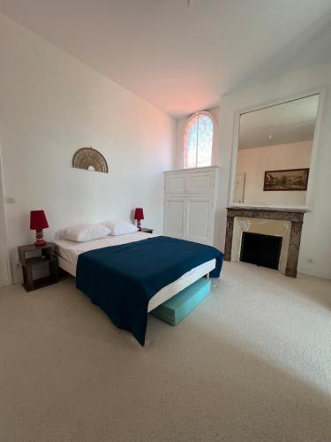 Ένα ή περισσότερα κρεβάτια σε δωμάτιο στο Appartement La parenthèse Arcachonnaise