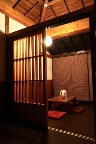 an entrance to a room with a table and a door at Sun Moon Home in Yuchi