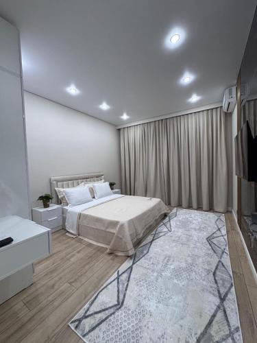 Ένα ή περισσότερα κρεβάτια σε δωμάτιο στο Апартаменты в ЖК 4YOU