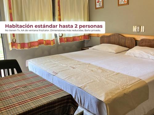 Postel nebo postele na pokoji v ubytování Hotel Cabañas Del Parque