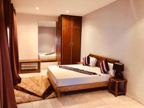 Postel nebo postele na pokoji v ubytování AS Appartement meublé