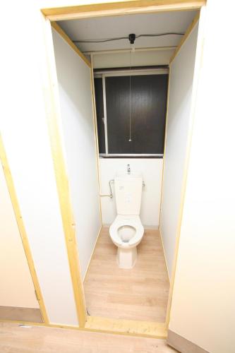 a bathroom with a toilet in a room at Edo Tokyo Hostel in Tokyo
