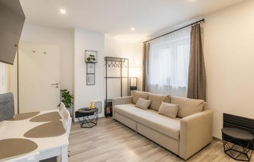 a living room with a couch and a table at Secret Collection in Frauenkirchen