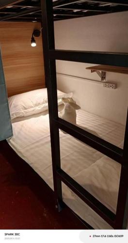 Llit o llits en una habitació de Mimosa Dormitory