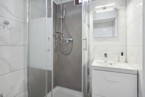 a bathroom with a shower and a sink at Studio Place Masséna Vieux Nice - situation idéale in Nice