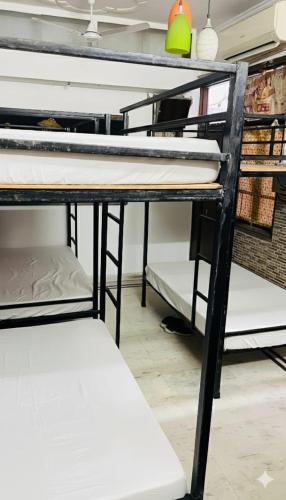 a group of bunk beds in a room at Gavari India's Delhi Hostel in New Delhi