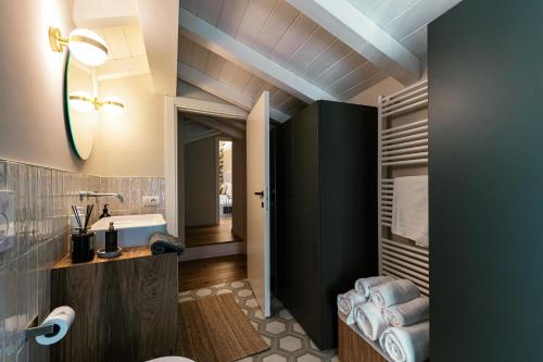 a bathroom with a sink and a toilet at Once in a Lifetime - by MyHomeInComo in Laglio