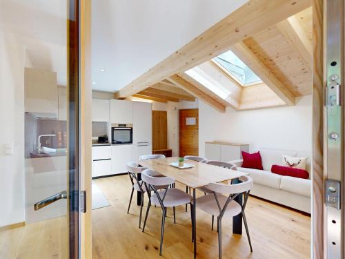a kitchen and dining room with a table and chairs at Aurturist Sesto in Sesto