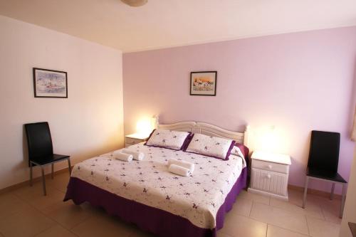 Postel nebo postele na pokoji v ubytování Casa Lara