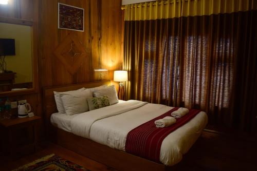 Ένα ή περισσότερα κρεβάτια σε δωμάτιο στο Hotel Elysium