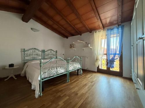 Ένα ή περισσότερα κρεβάτια σε δωμάτιο στο Camere La Ro Ca- Telti