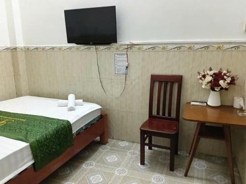TV a/nebo společenská místnost v ubytování Thanh Long Hotel Hồ Chí Minh