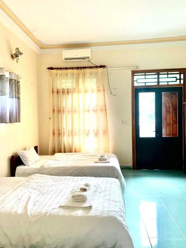 Ένα ή περισσότερα κρεβάτια σε δωμάτιο στο Khách sạn phong châu sốp cộp