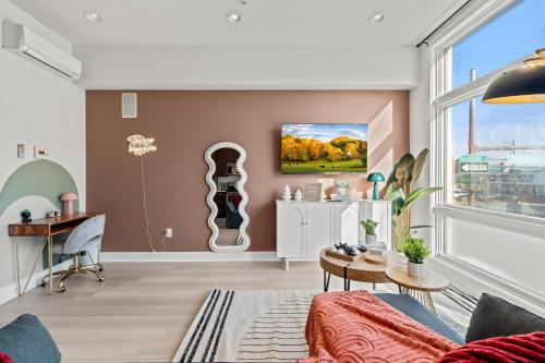 a living room with a couch and a table at Modern 1BR Apartment Downtown Philly Near MET in Philadelphia