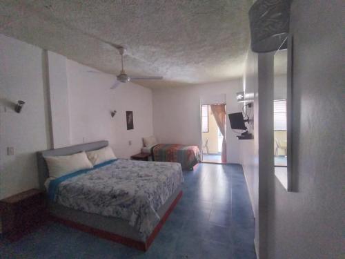 Postel nebo postele na pokoji v ubytování Apartamentos grigri