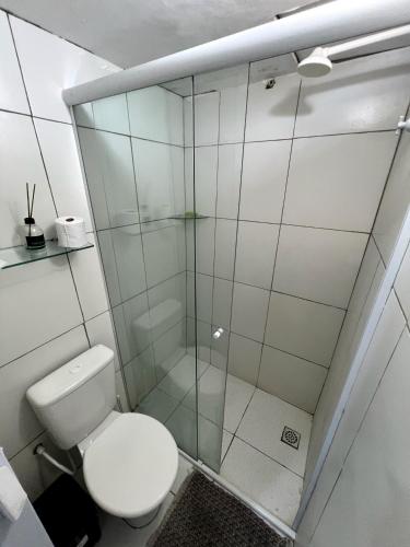 a bathroom with a toilet and a glass shower at Durmaaquislz in São Luís