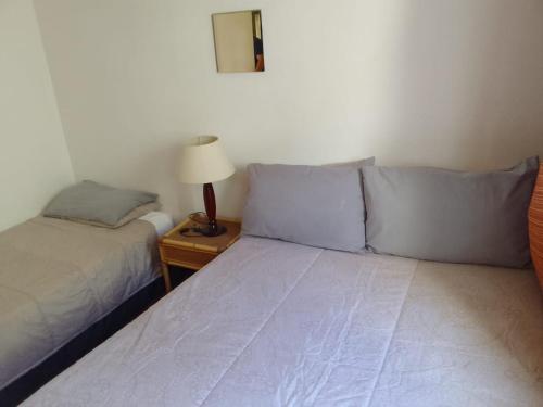 Postel nebo postele na pokoji v ubytování Sandoway