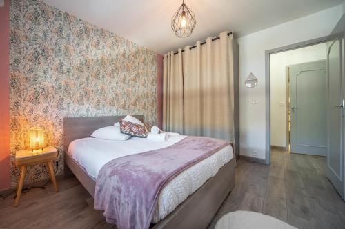 Llit o llits en una habitació de Les Lauriers