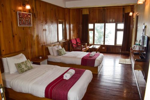 Ένα ή περισσότερα κρεβάτια σε δωμάτιο στο Hotel Elysium