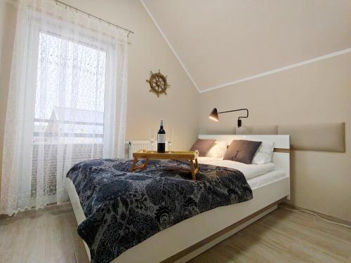 Postel nebo postele na pokoji v ubytování Morska Przystań e-apart pl