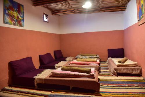 Een bed of bedden in een kamer bij Terregite Taghit