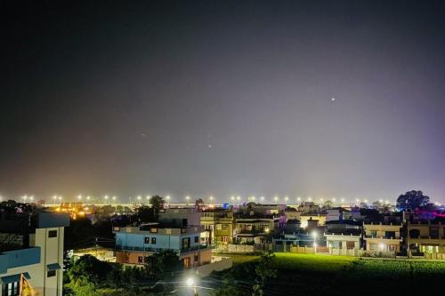 a view of a city at night with lights at The Nest spacious and homely flat in Haldwani in Haldwāni