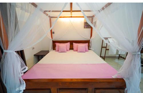 Ένα ή περισσότερα κρεβάτια σε δωμάτιο στο Moon View Homestay