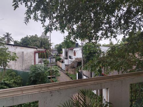 a view from a balcony of a street with buildings at Vista bella in Tangalle