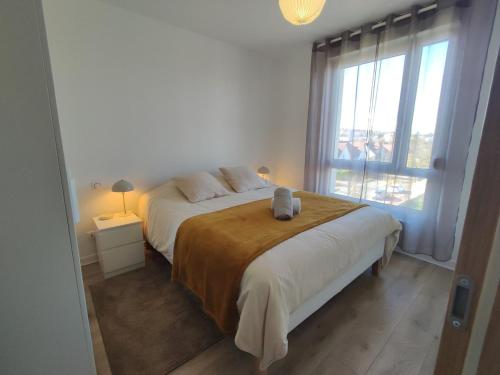 Postel nebo postele na pokoji v ubytování Duplex moderne, chaleureux au calme à Toison d'or