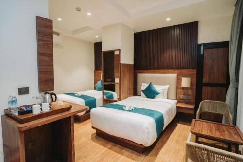 Ένα ή περισσότερα κρεβάτια σε δωμάτιο στο Hotel The Infinity Near Delhi Airport