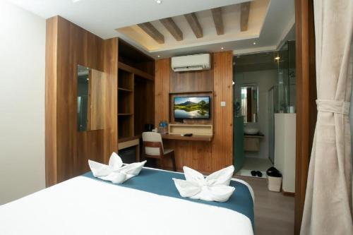 Ένα ή περισσότερα κρεβάτια σε δωμάτιο στο Hotel The Infinity Near Delhi Airport