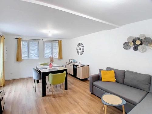 a living room with a couch and a table at Appartement Criel-sur-Mer in Criel-sur-Mer