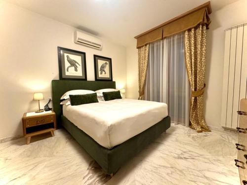 a bedroom with a large bed and a window at Antella Residence in Bagno a Ripoli